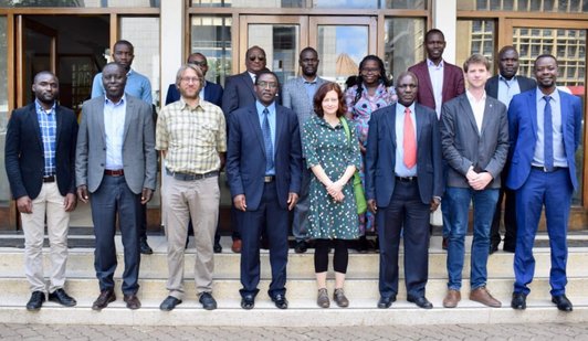 people standing in front of a building for a group picture