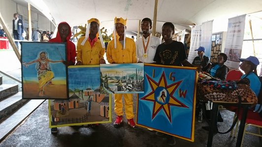 Five boys presenting and holding some artwork