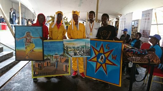 Five boys presenting and holding some artwork