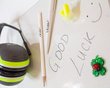  Writing pads with pencil and lucky charm with the words Good Luck