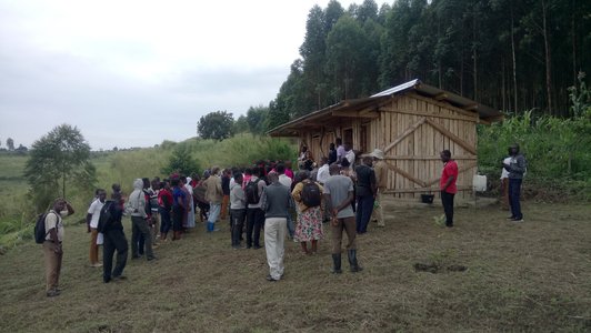 Head of demonstration farm gives tour to visitors