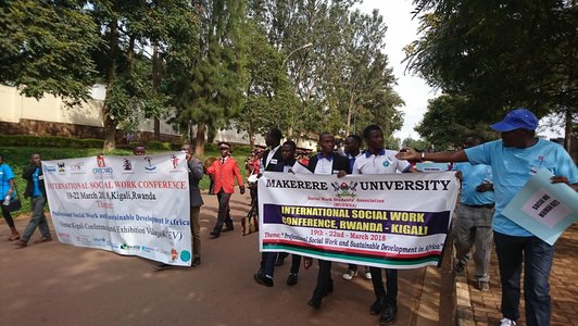 Group of people with big information flags marching on the streets