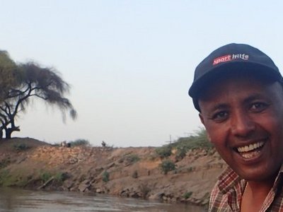 Dr. Aschalew at the middle-section of the Awash river helping fish scientist to gather data