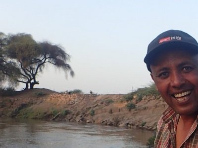 Dr. Aschalew at the middle-section of the Awash river helping fish scientist to gather data