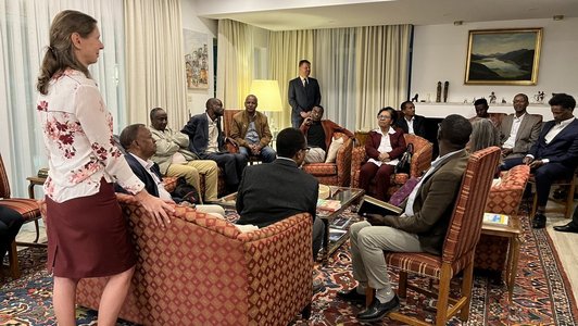 People seated in a large living room