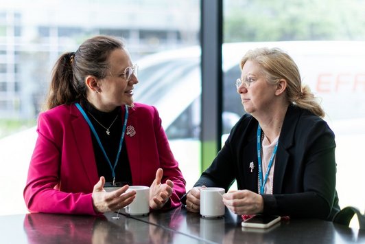 Participants talk during the coffee break