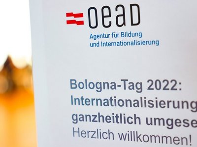 OeAD Logo mit Bildunterschrift zum Bologna-Tag 2022