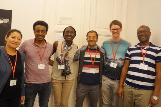 Six OeAD scholarship holders taking a photo together at the event in Graz.