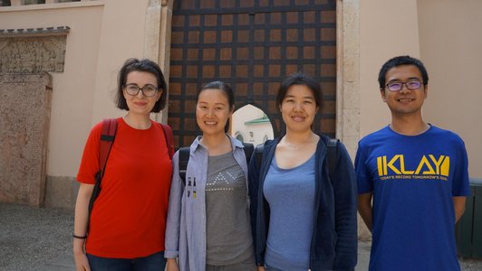 For scholarship holders standing in front of a gate at the park in Laxenburg and smiling to the camera