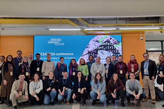 Gruppenfoto vor ECSA-Plakat