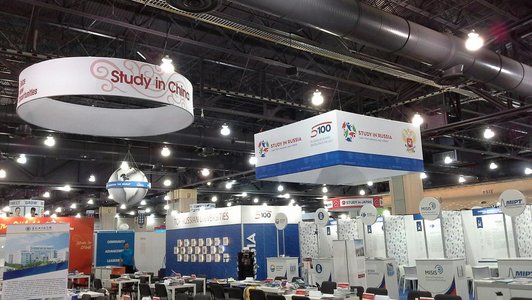  Exhibition hall at the NAFSA 2018 education fair. Several information stands can be seen.