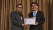 Dr. Basanta Adhikari and a second man holding a certificate