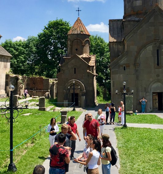 Group of people standing in front of a church