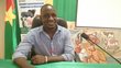 Young scholarship holder from Burkina Faso sitting on a chair in front of the microphone preparing for an interview