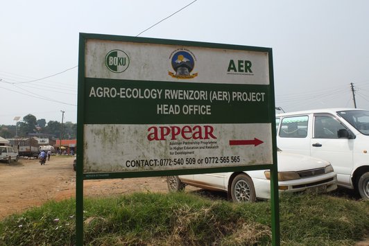 Information board of an APPEAR Project standing outdoor in a village