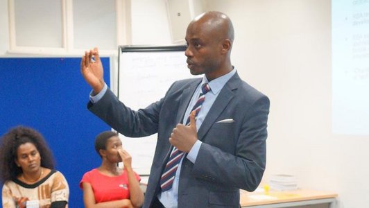 A man talking and gesticulating with his hands