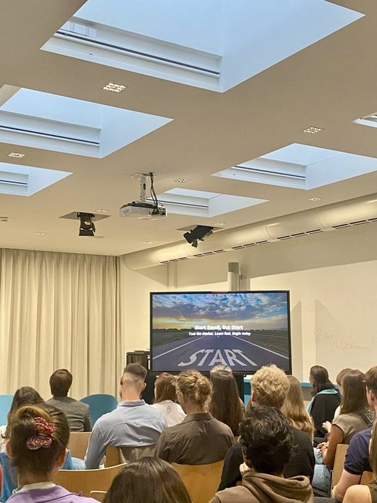 Screen that shows picture of a road and the sentence "start small, but start"