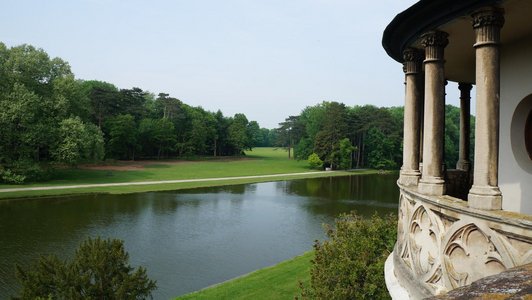 picture shows parts of the lake, the green area and an ancient building in the Laxenburg part