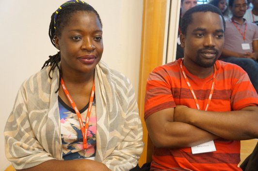 Two OeAD scholarship holders sit in the audience.