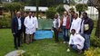 Scientists standing in the premises of the research center and posing next to aquarium 