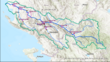 Figure 1 Map of Vjosa catchment (in green) with defined reaches (pink boxes) and water quality monitoring stations (orange points).