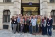 Group picture of 20 people standing in front of the OeAD