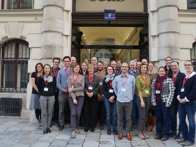 Group picture of 20 people standing in front of the OeAD