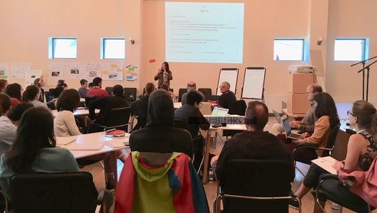 Participants of summer school listening to the presenter