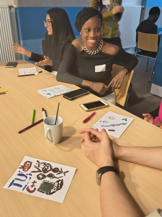 Scholarship holders talking about their paintings