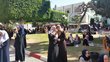 Female students in burqas in a park on a university campus in the Gaza Strip