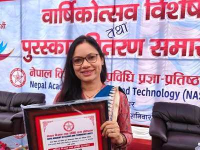 Photo of Sony Baral with award