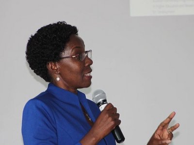 Woman speaking into a microphone