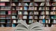 Open book on table in a library