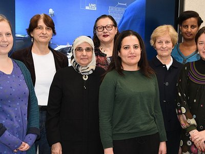 Group of people posing for a picture