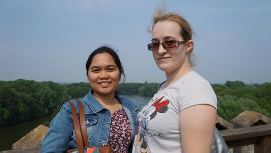 two students standing on the high view point in the Laxenburg castle and posing for the photo