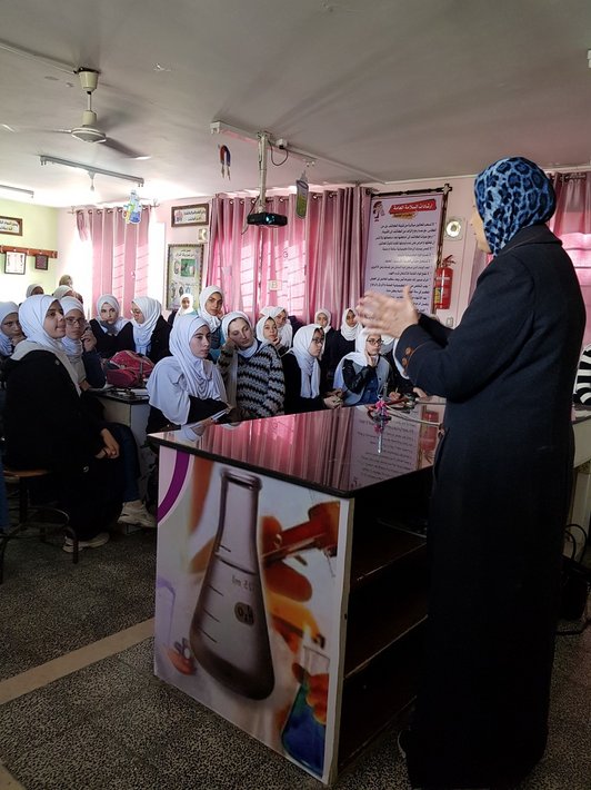 Female Professor gives lecture to female high school students