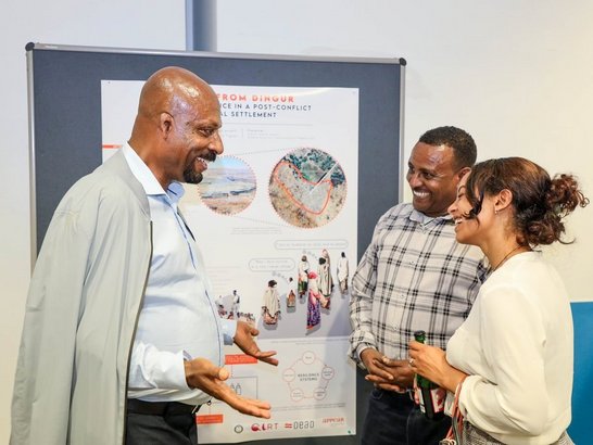 Participants discussing a poster