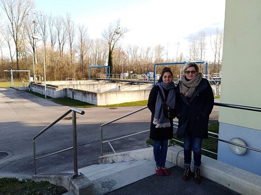 Two women standing in front of the waterworks