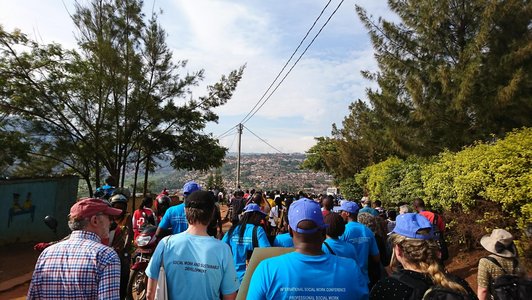 Group of people from their backsides marching on the streets