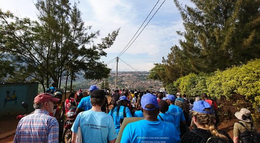 Group of people from their backsides marching on the streets