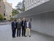 Project team members posing for a group picture in front of the World Bank