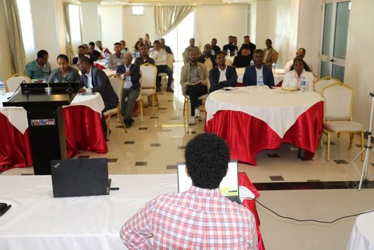 View from behind a speaker looking at the audience
