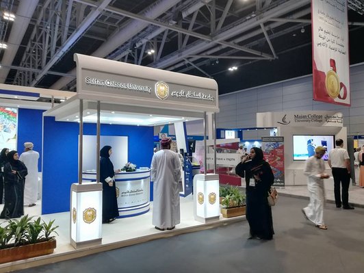 Ghedex education fair in Oman: Exhibition hall with stands and visitors