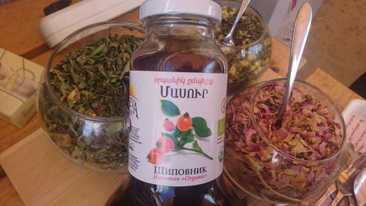 Various organic herbs in glass bowls