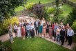 OeAD Managing Director Stefan Zotti and Regina Aichner with Chinese scholarship holders at the European Forum Alpbach 2018. They are standing in a path surrounded by green meadows and trees.