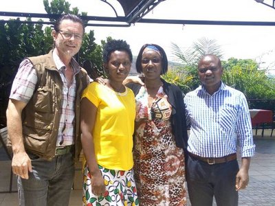 Group of 4 persons posing for a group photo