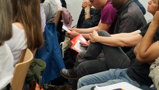 Coseupview of a group of people sitting arranged in rows