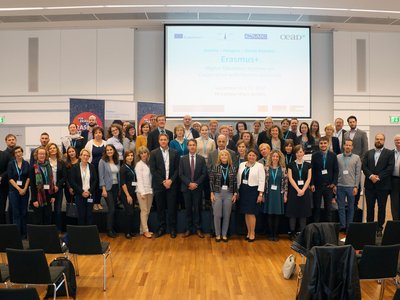 Seminar participants standing in front of stage