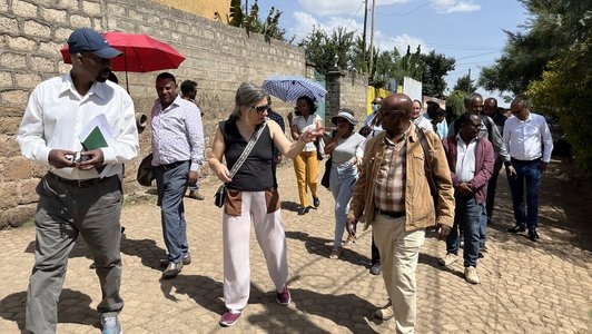 A group of people walking along a street