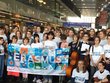 Group photo with school children holding a banner with the word Erasmus.